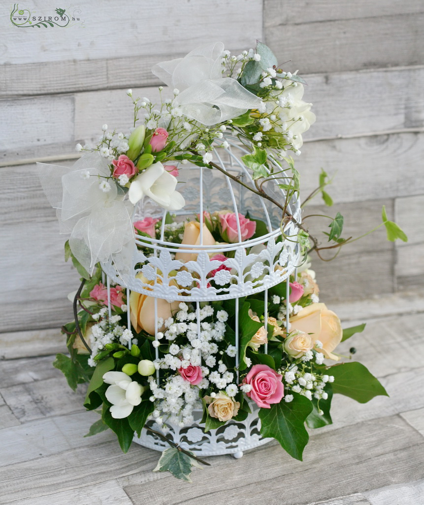 flower delivery Budapest - Wedding centerpiece bird cage with pastel flowers (pink, peach, gypsophila, rose, freesia)